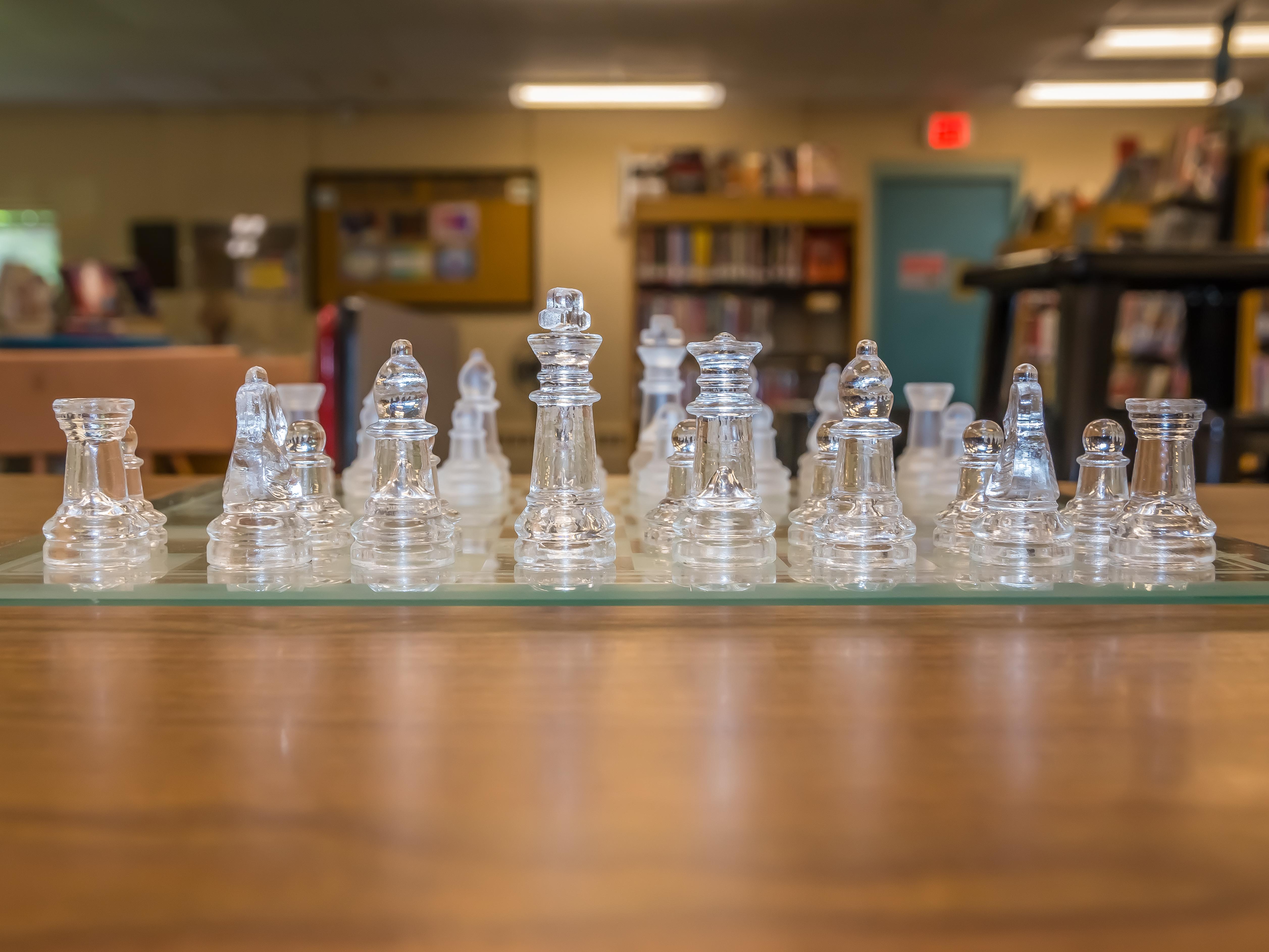chess game with teen area in background